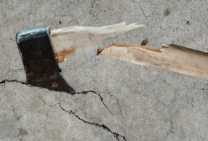 Broken axe on a concrete floor