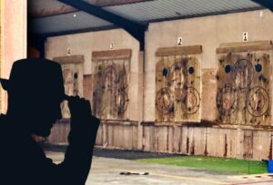 Inside a barn with axe throwing boards along one wall