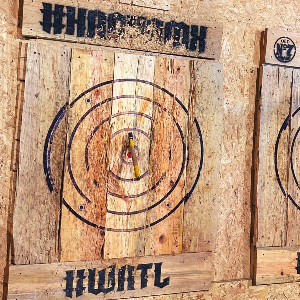 Axe throwing target with not very cool pine planks looking very beaten up