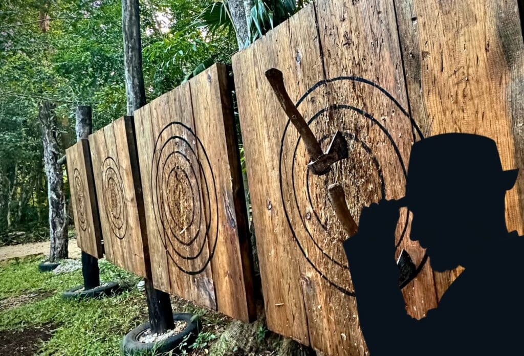 outdoor axe throwing boards with a silhouette of the Axe Inspector in front