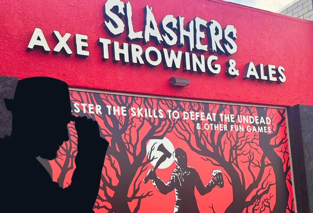 Outside of the Slashers Axe Throwing venue with a poster showing a forest and horror style axe wielding man